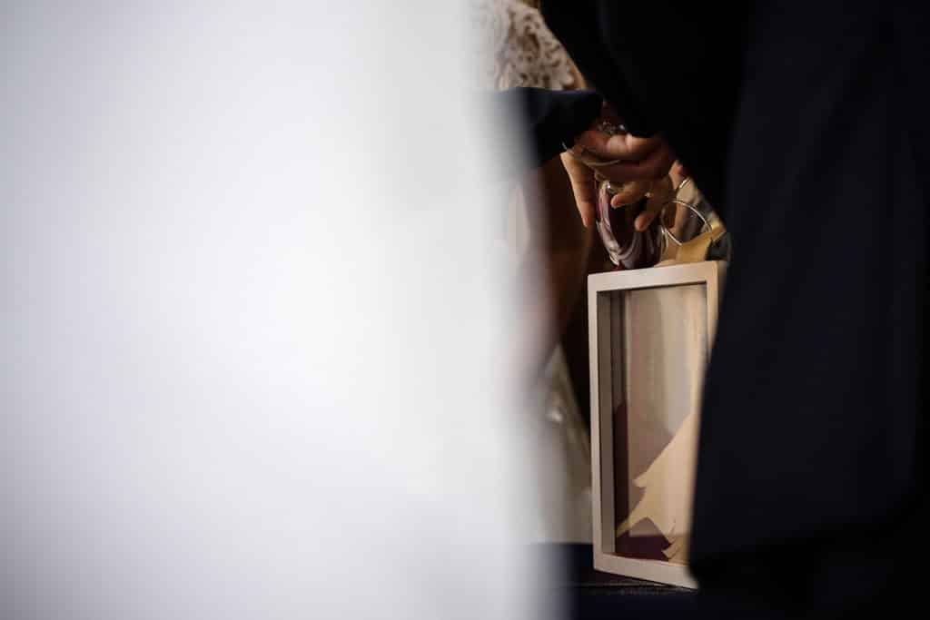 Children at wedding pouring unity sand during ceremony