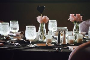 Wedding reception seating showcasing a pink and black tablescape