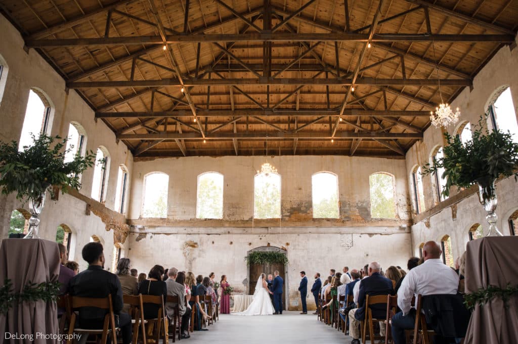 Bride and groom ceremony at Providence Cotton Mill by Charlotte Wedding Photographers DeLong Photography