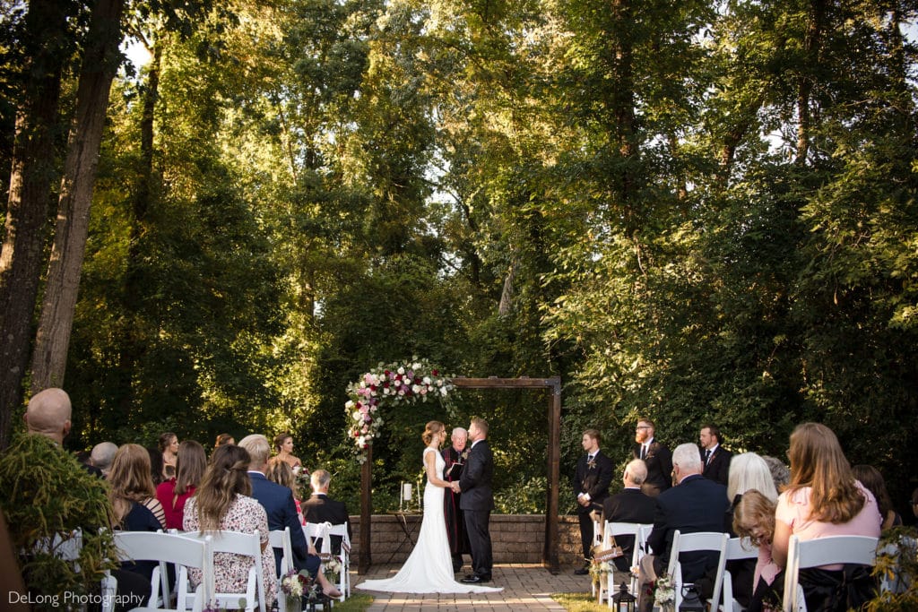 Wide shot of outdoor wedding ceremony at Ritchie Hill by Charlotte Wedding Photographers DeLong Photography
