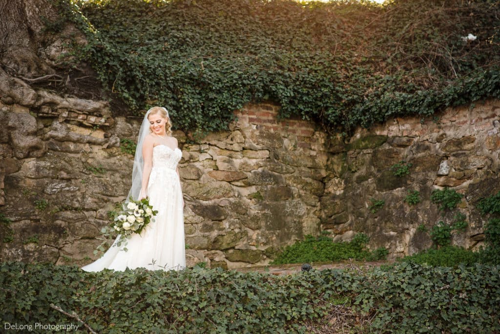 Bridal portrait outside in front of vines at The Laboratory Mill by Charlotte Wedding Photographers DeLong Photography
