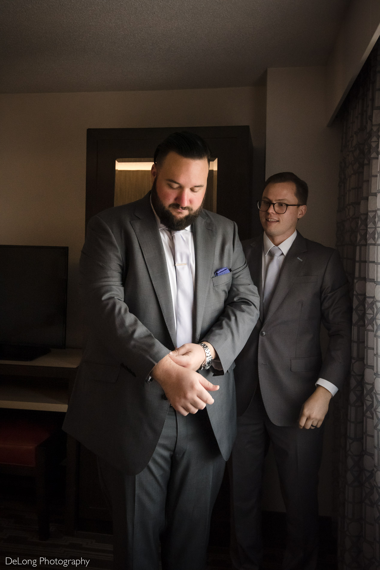 Groom getting ready image at the Embassy Suites by Hilton Charlotte  by Charlotte wedding photographers DeLong Photography