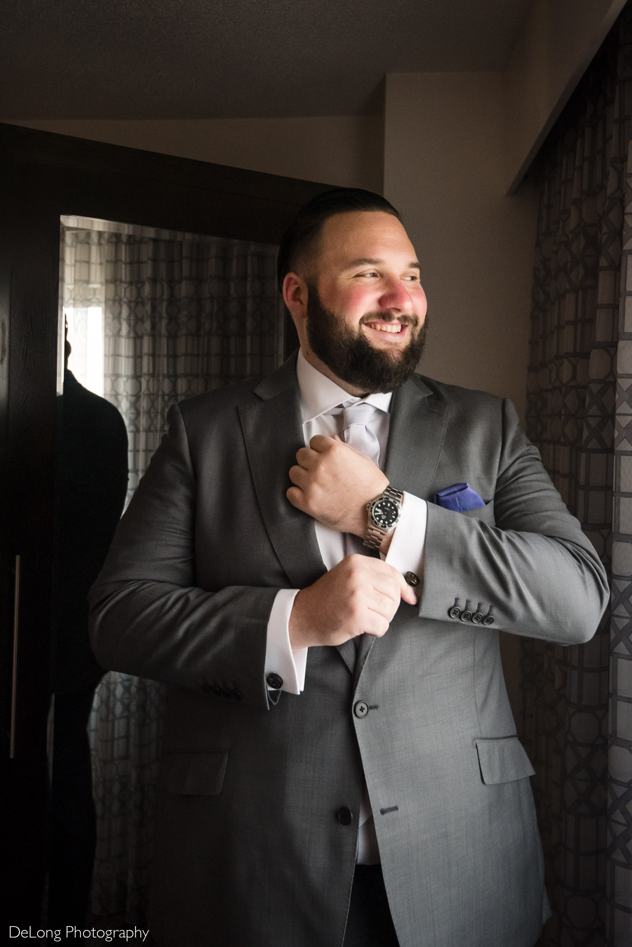 Groom getting ready image at the Embassy Suites by Hilton Charlotte  by Charlotte wedding photographers DeLong Photography