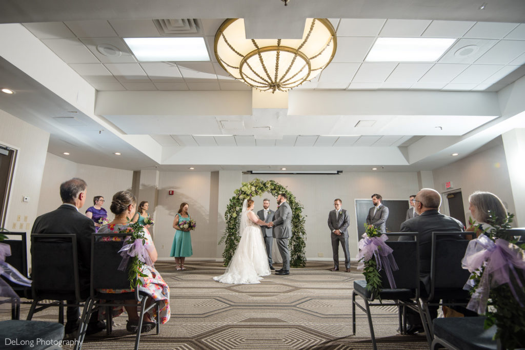 Wedding ceremony at the Embassy Suites by Hilton Charlotte by Charlotte wedding photographers DeLong Photography