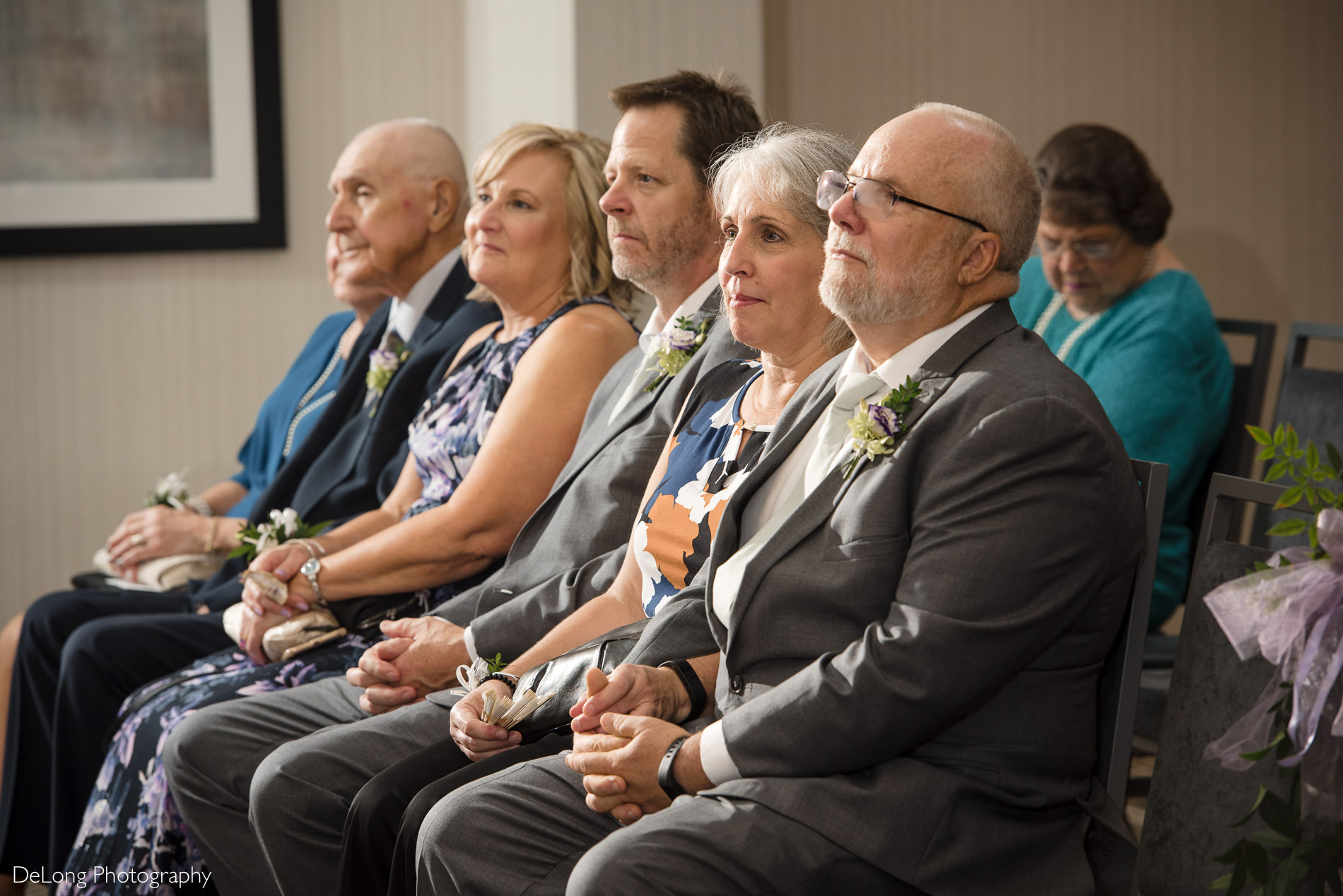 Groom's parents during wedding ceremony by Charlotte wedding photographers DeLong Photography