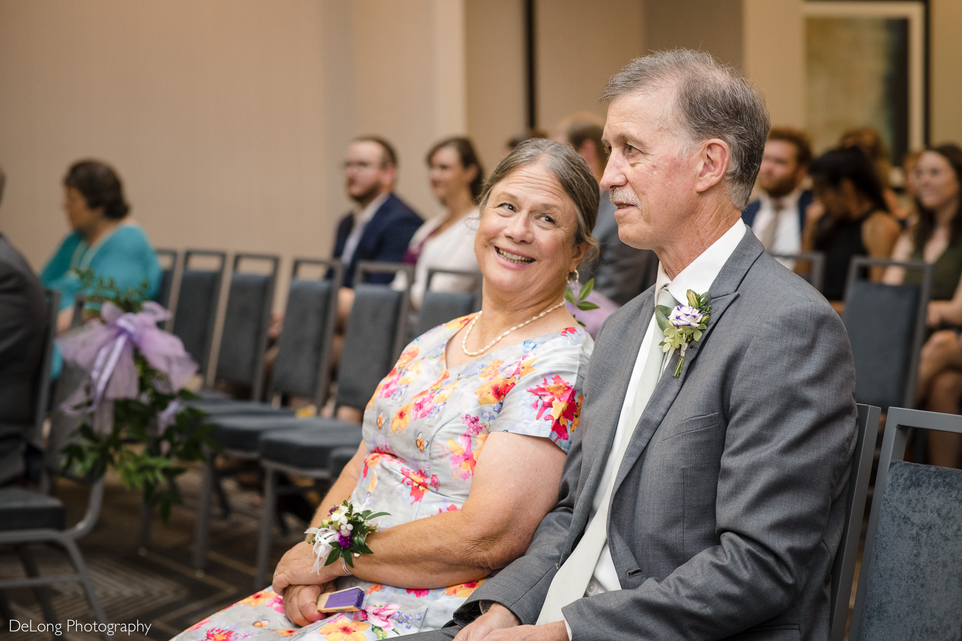 Bride's parents during wedding ceremony by Charlotte wedding photographers DeLong Photography