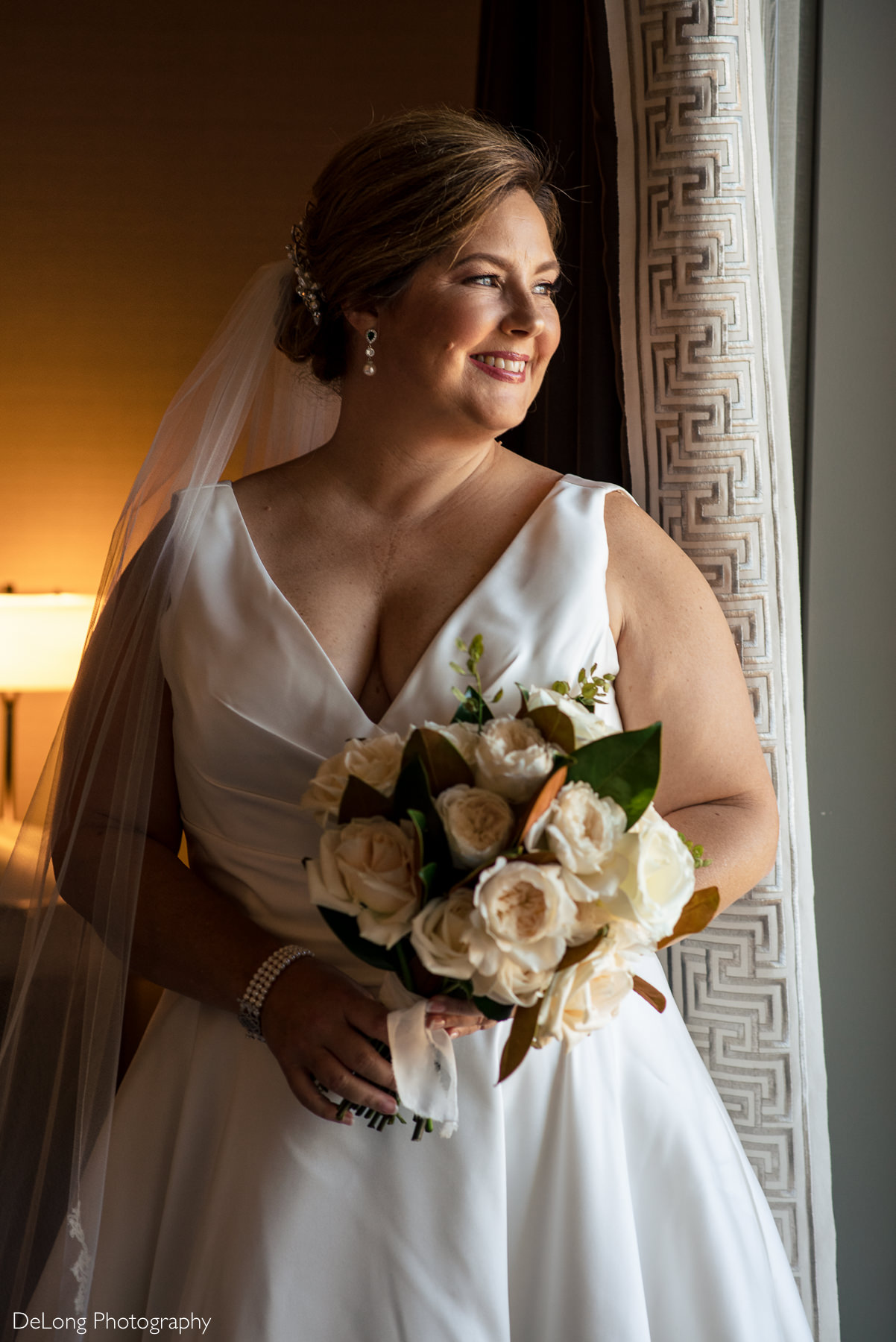 Indoor bride portrait at the Ballantyne Hotel by Charlotte Wedding Photographers DeLong Photography