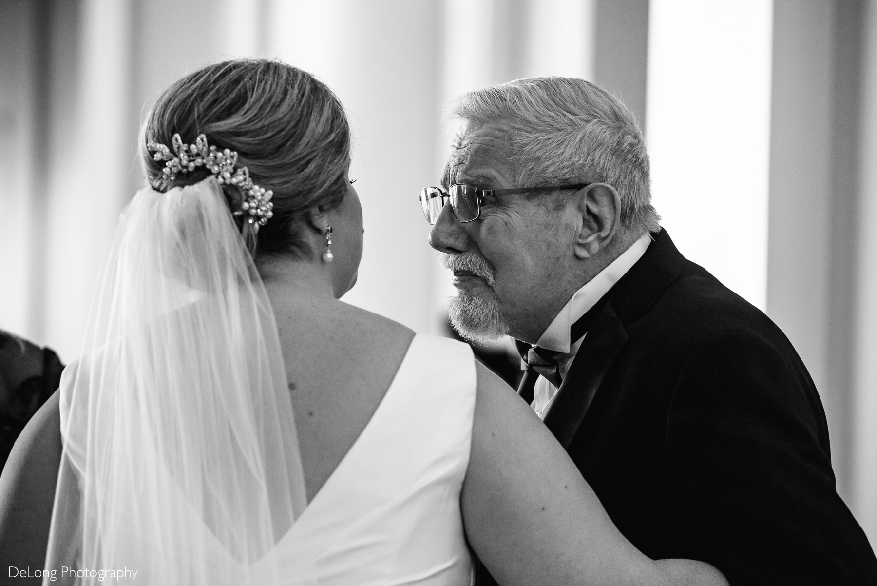 Dad tearing up during the first look with his daughter by Charlotte Wedding Photographers DeLong Photography