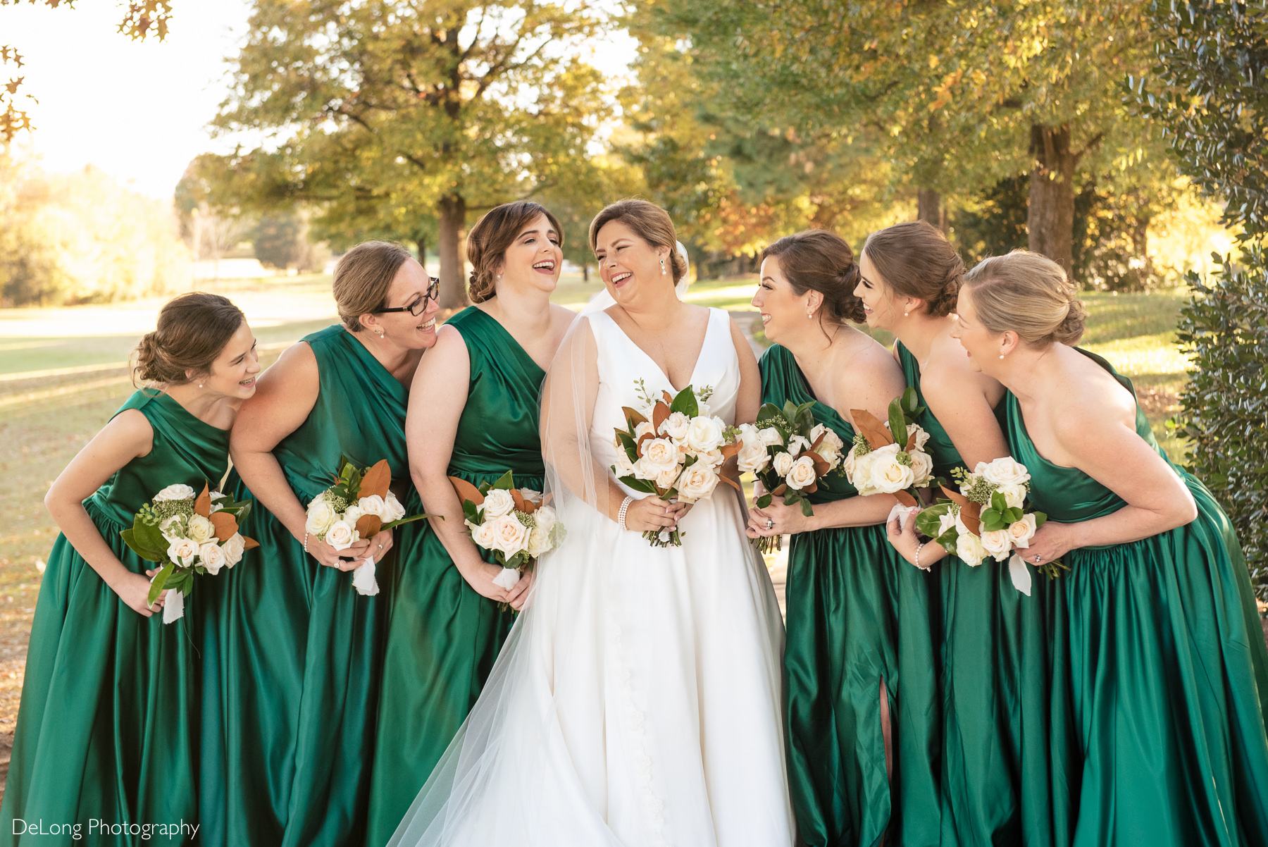 Bride and bridesmaids laughing together at the Club at Longview by Charlotte Wedding Photographers DeLong Photography