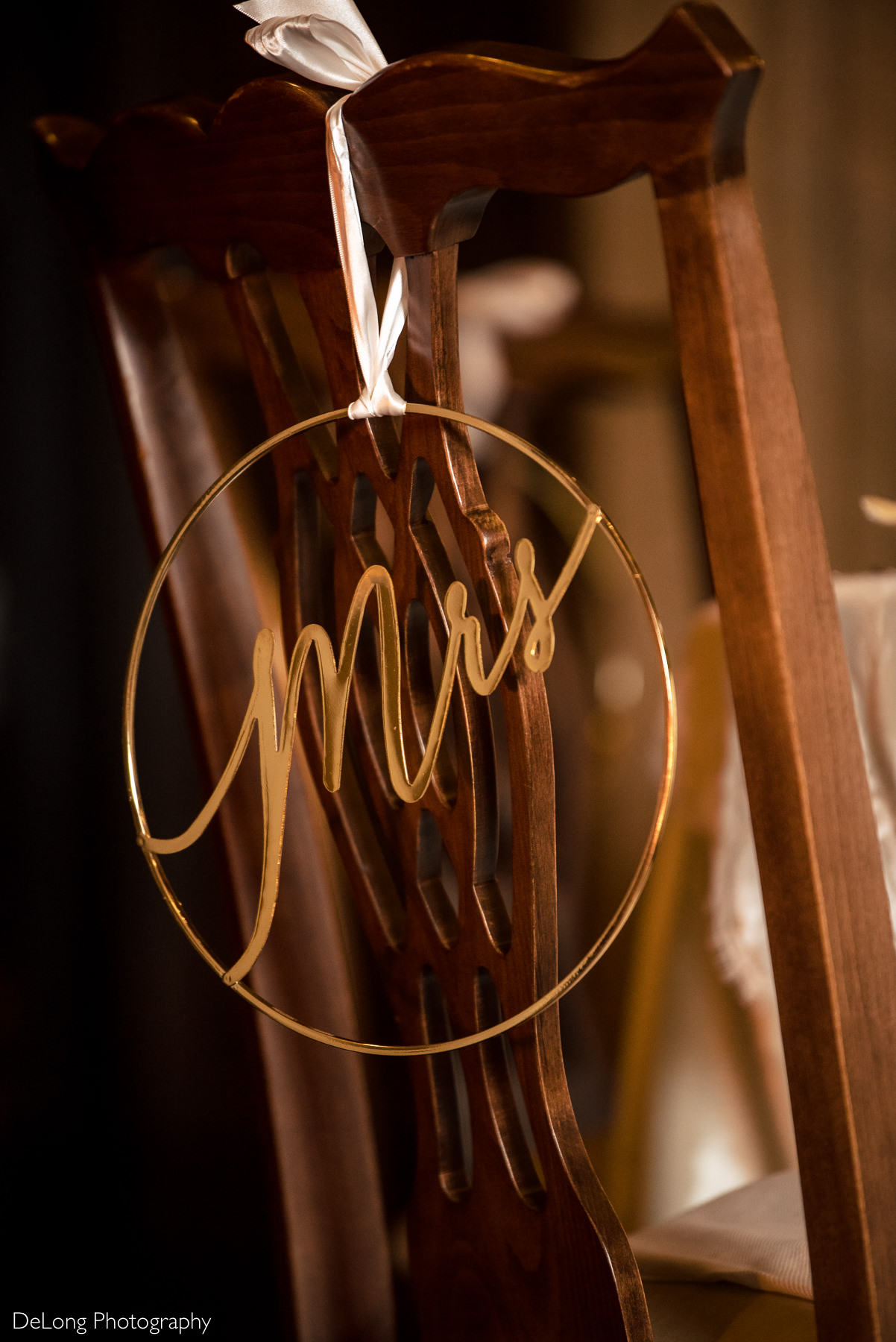 Gold "Mrs" chair sign at wedding reception at The Club at Longview by Charlotte Wedding Photographers DeLong Photography