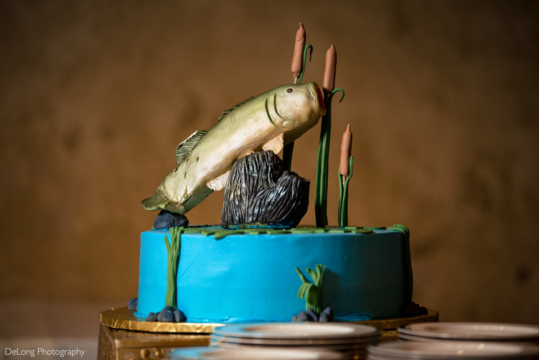Fishing themed groom's cake with bass jumping out of the water at The Club at Longview wedding by Charlotte Wedding Photographers DeLong Photography