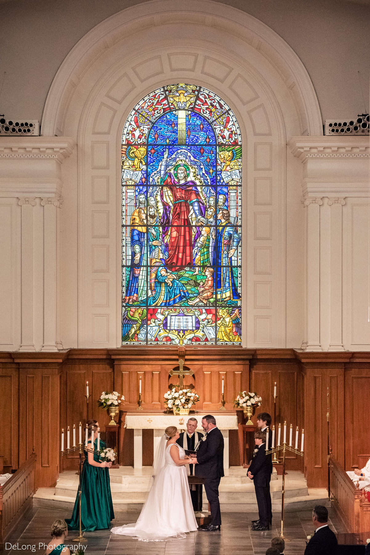 Bride and groom sharing vows at Providence Methodist Church by Charlotte Wedding Photographers DeLong Photography