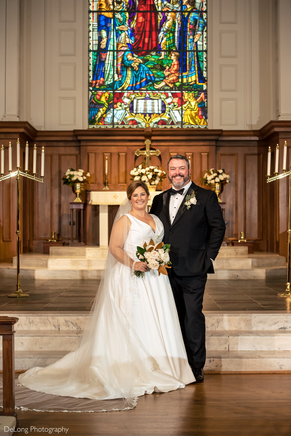 Bride and groom portrait at the altar of Providence Methodist Church by Charlotte Wedding Photographers DeLong Photography