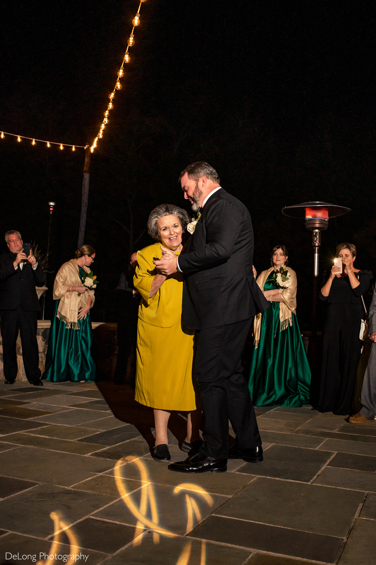 Mother-son dance at night on the terrace of the Club at Longview by Charlotte Wedding Photographers DeLong Photography