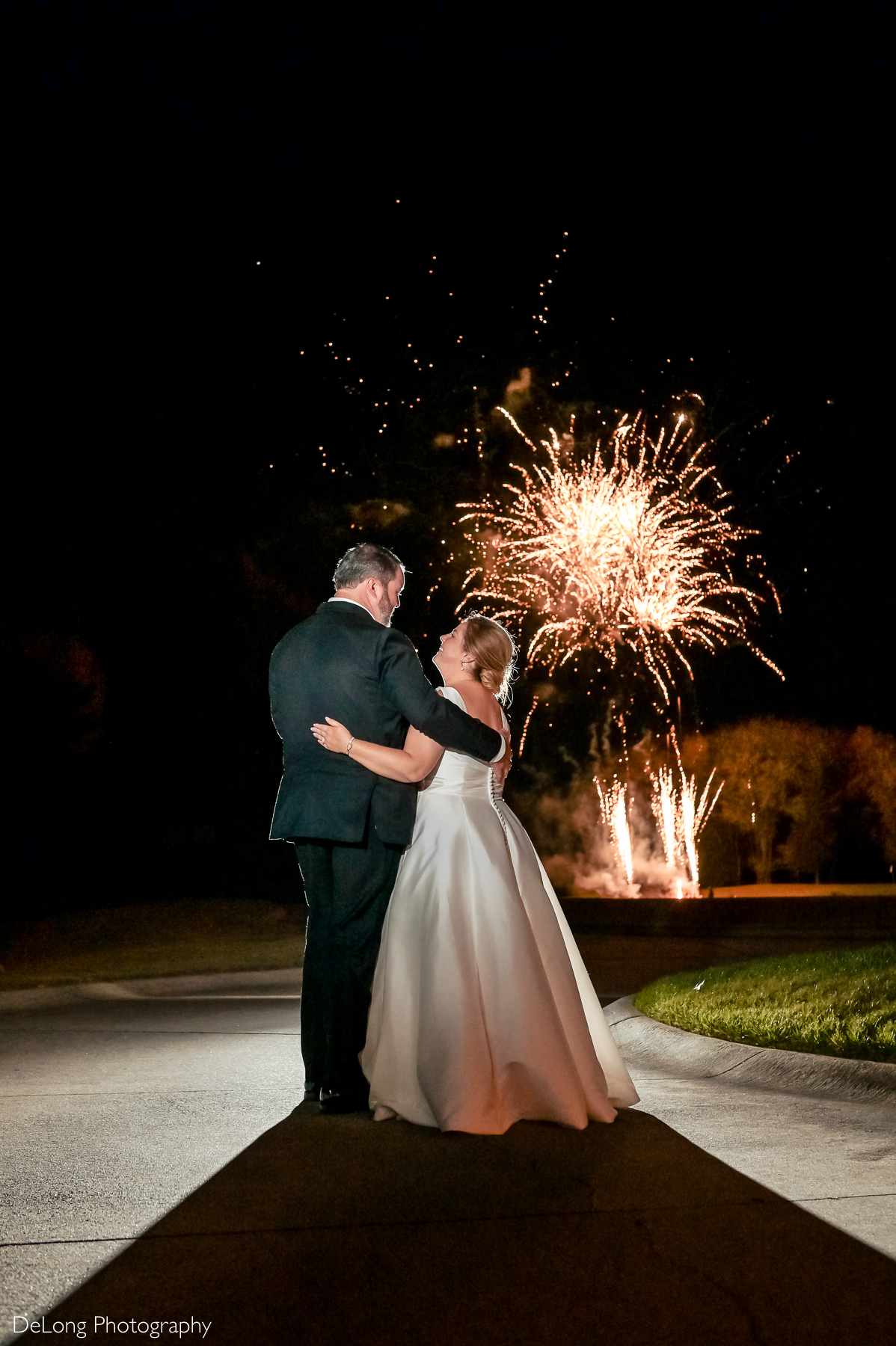 Bride and groom enjoy fireworks show at the Club at Longview by Charlotte Wedding Photographers DeLong Photography