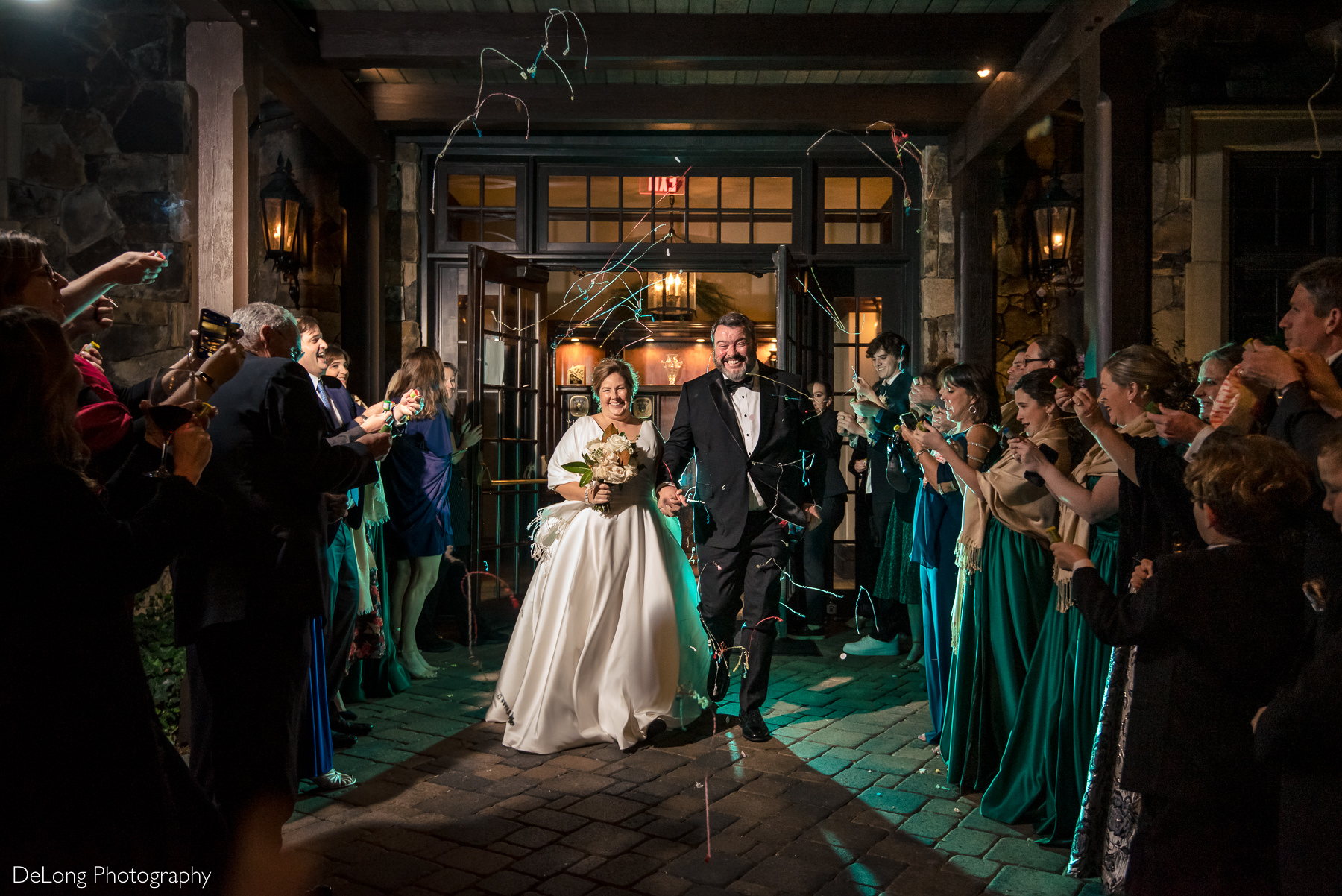 Bride and groom streamer exit at the Club at Longview by Charlotte Wedding Photographers DeLong Photography