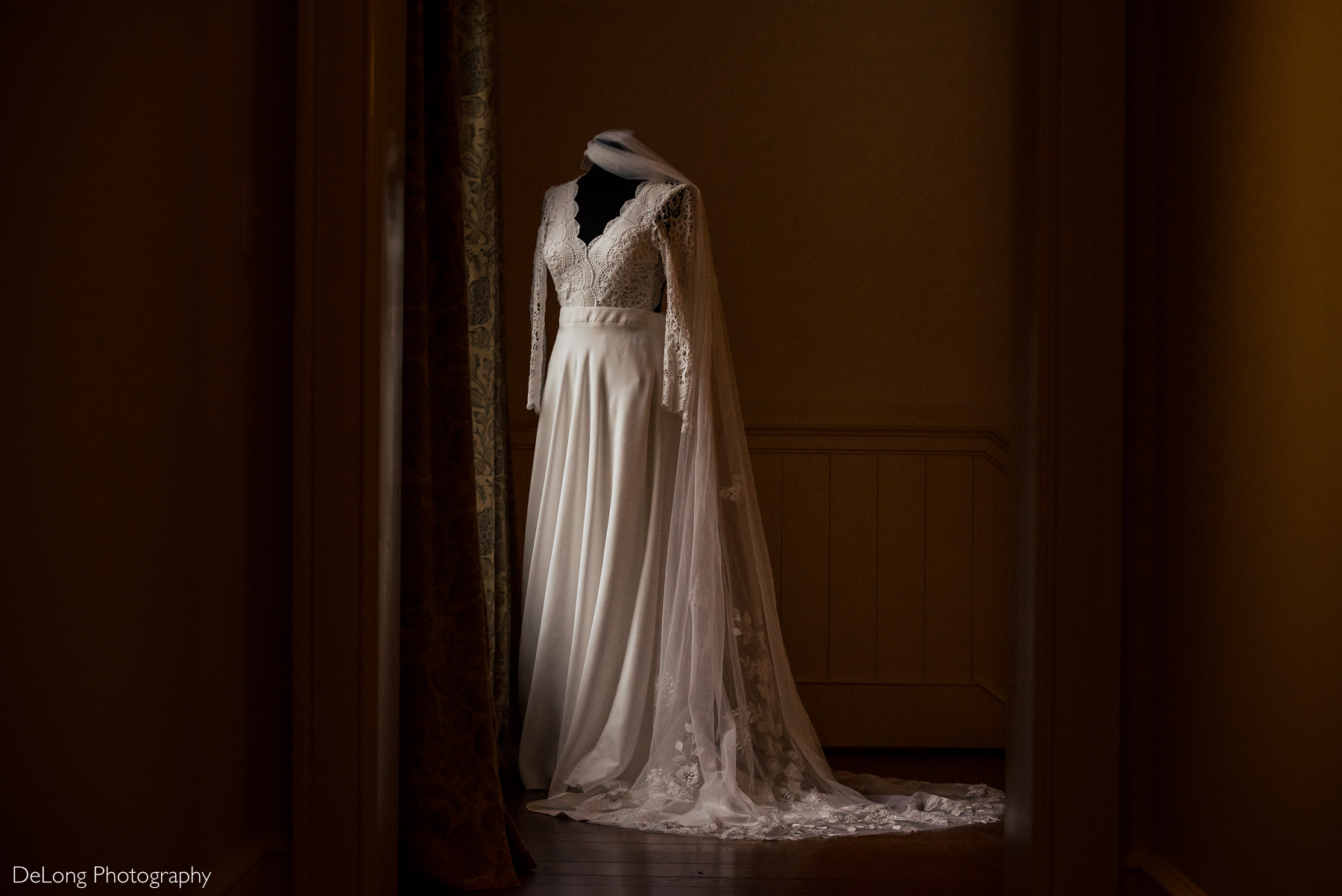 Bride's Lulus wedding dress and veil on a mannequin by Charlotte wedding photographers DeLong Photography