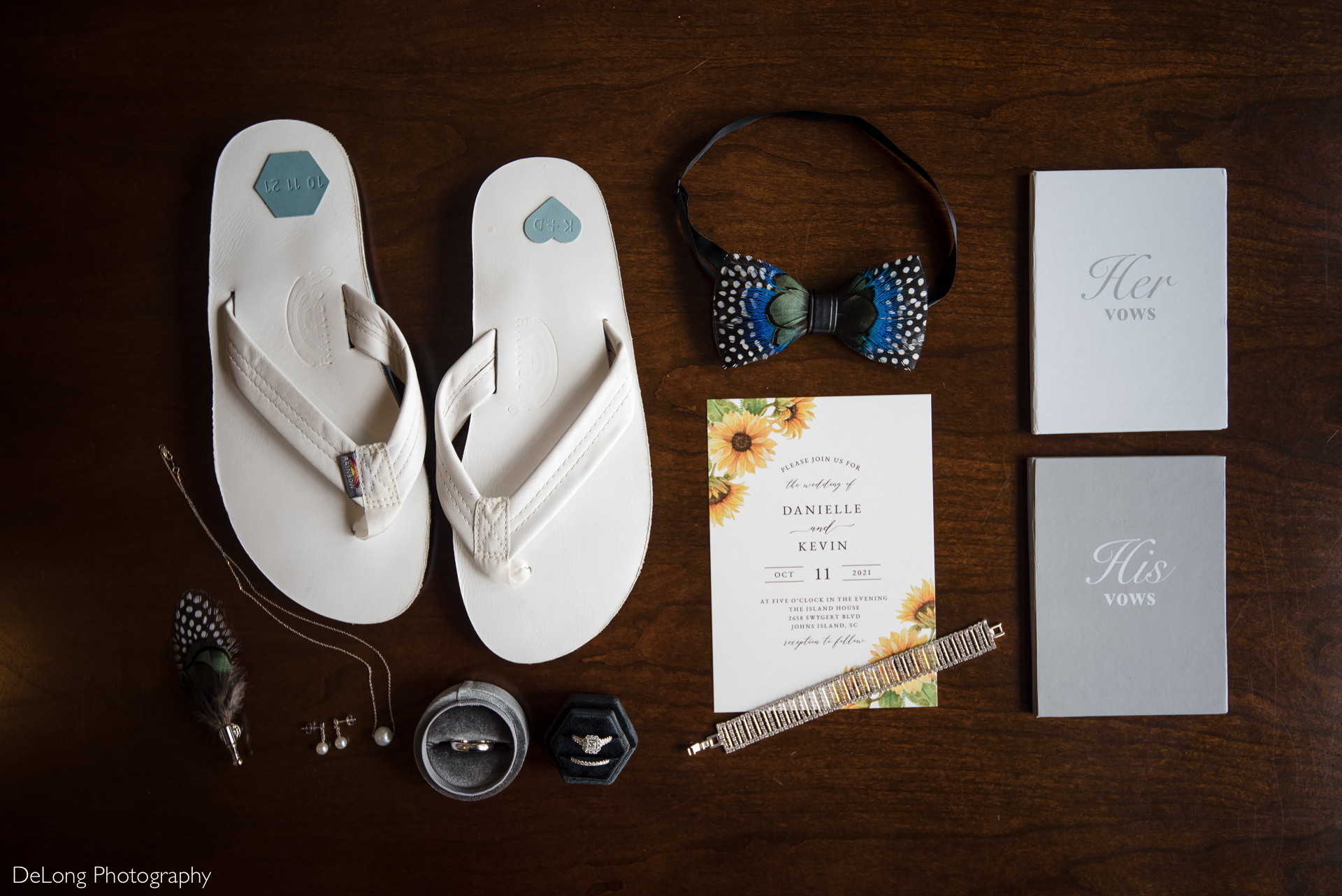 Flat lay of wedding details including shoes, invitation, bow tie, rings, and jewelry by Charlotte Wedding Photographers DeLong Photography