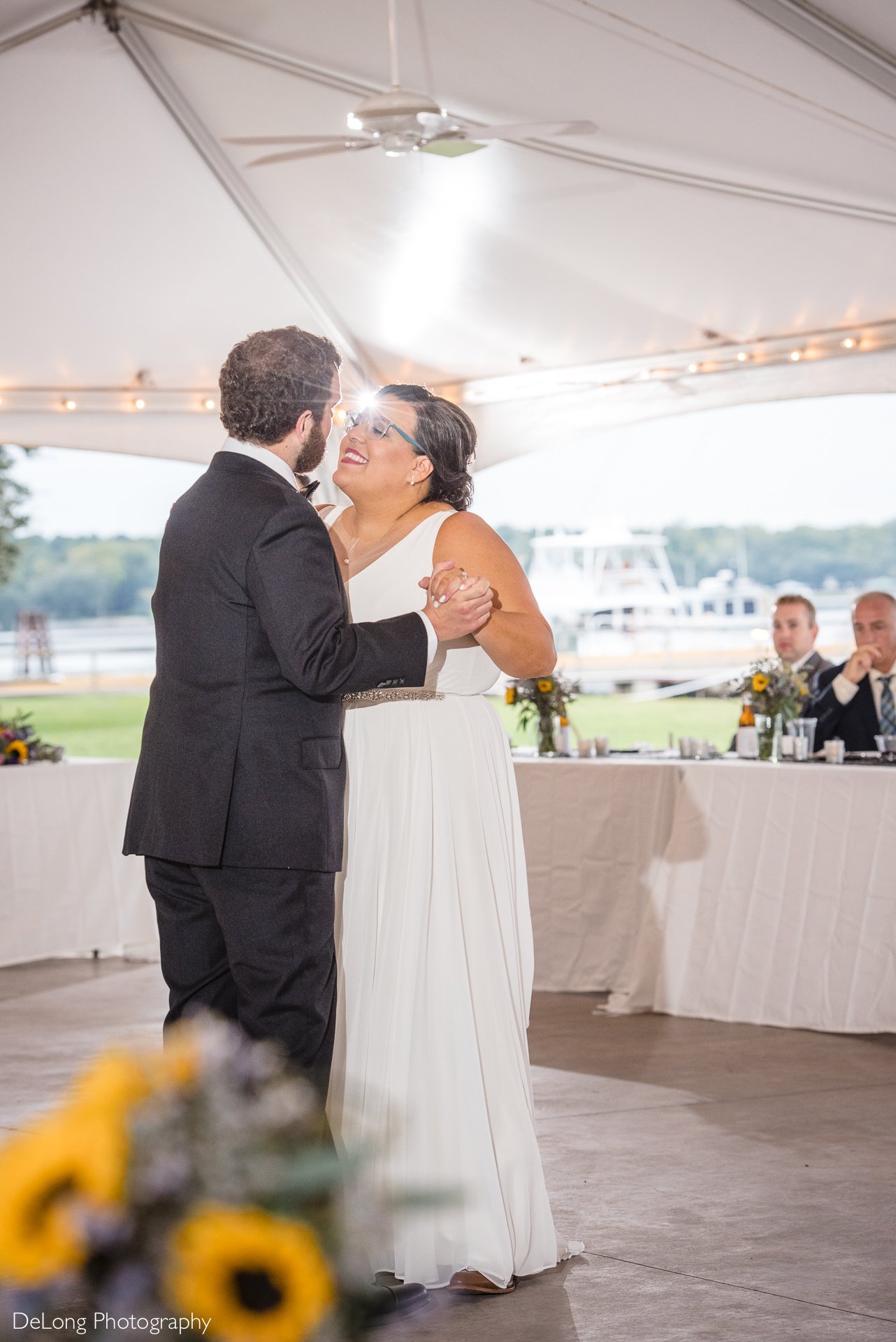 Bride and smiling at the groom during their first dance at the Island House in Charleston, SC by Charlotte Wedding Photographers DeLong Photography