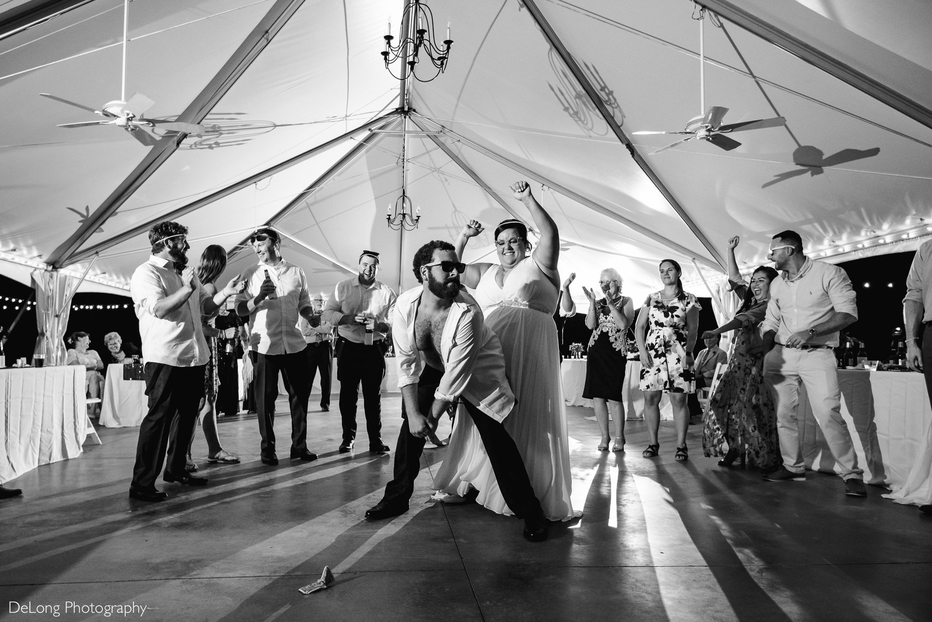 Groom booty dancing on bride on the dance floor during wedding reception at the Island House in Charleston, SC by Charlotte Wedding Photographers DeLong Photography