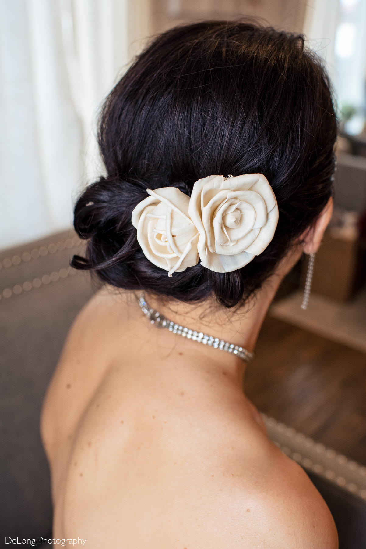 Image of roses in bride's hair in bridal suite at Childress Vineyards by Charlotte Wedding Photographers DeLong Photography