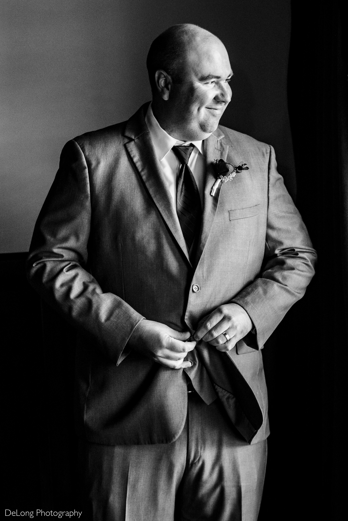 Groom getting ready in groom's suite at Childress Vineyards by Charlotte Wedding Photographers DeLong Photography