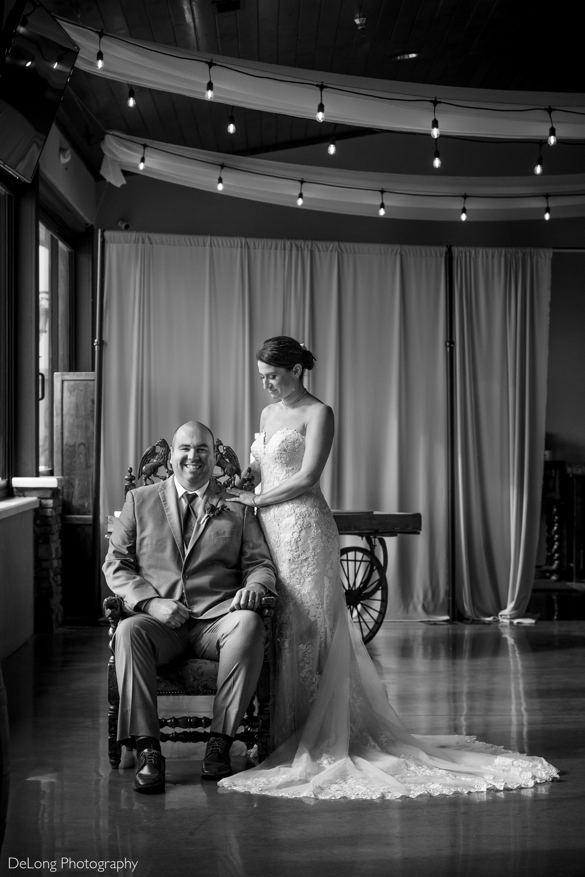 Black and white indoor portrait of bride and groom at Childress Vineyards by Charlotte Wedding Photographers DeLong Photography