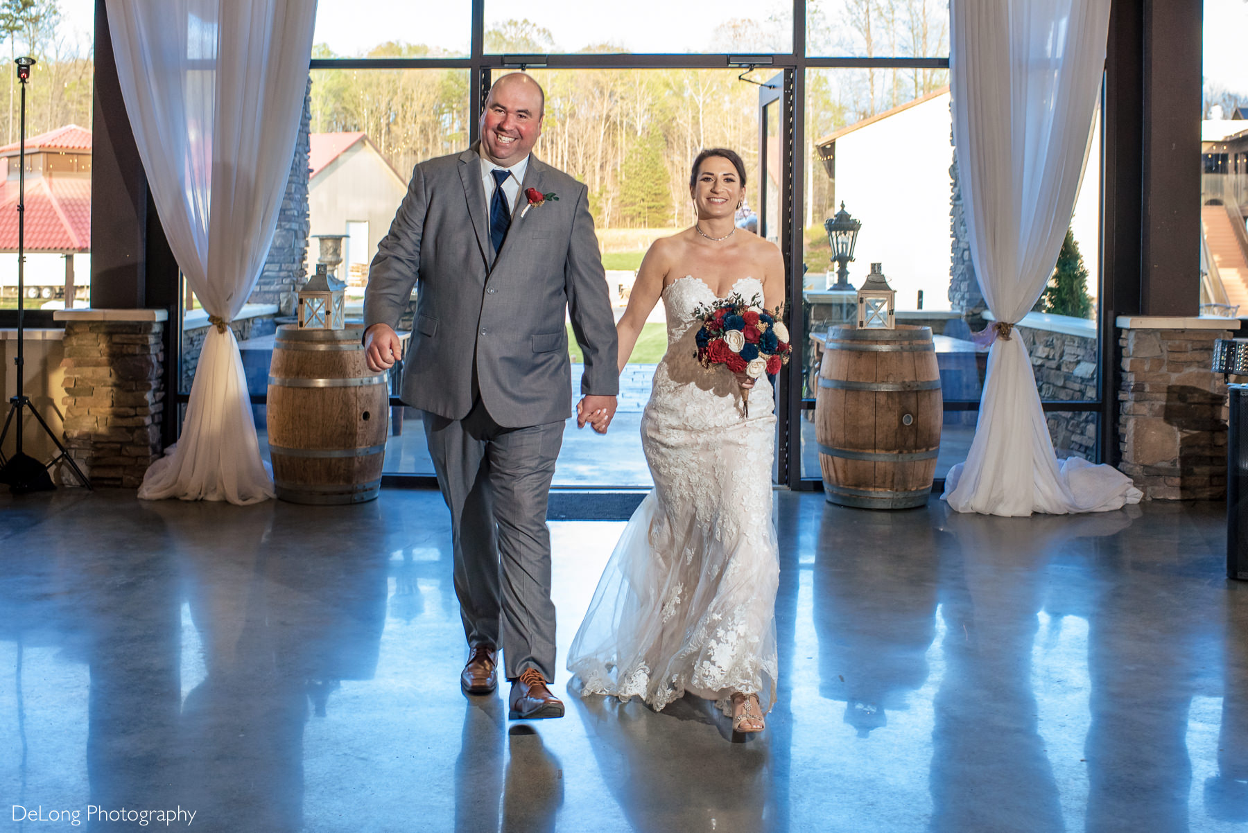 Bride and groom reception entrance at Childress Vineyards by Charlotte Wedding Photographers DeLong Photography