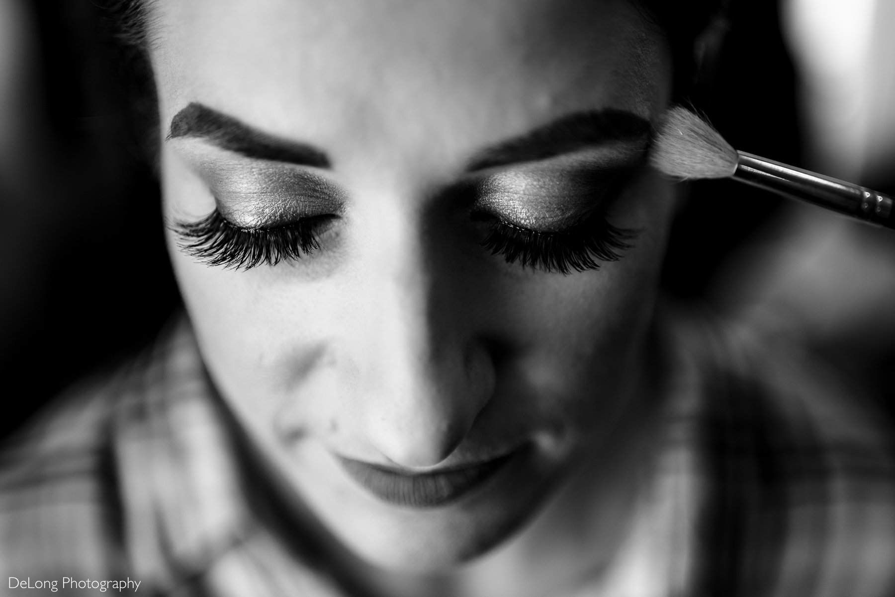 Up close black and white photograph of bride's eyelashes during getting ready by Charlotte Wedding Photographers DeLong Photography