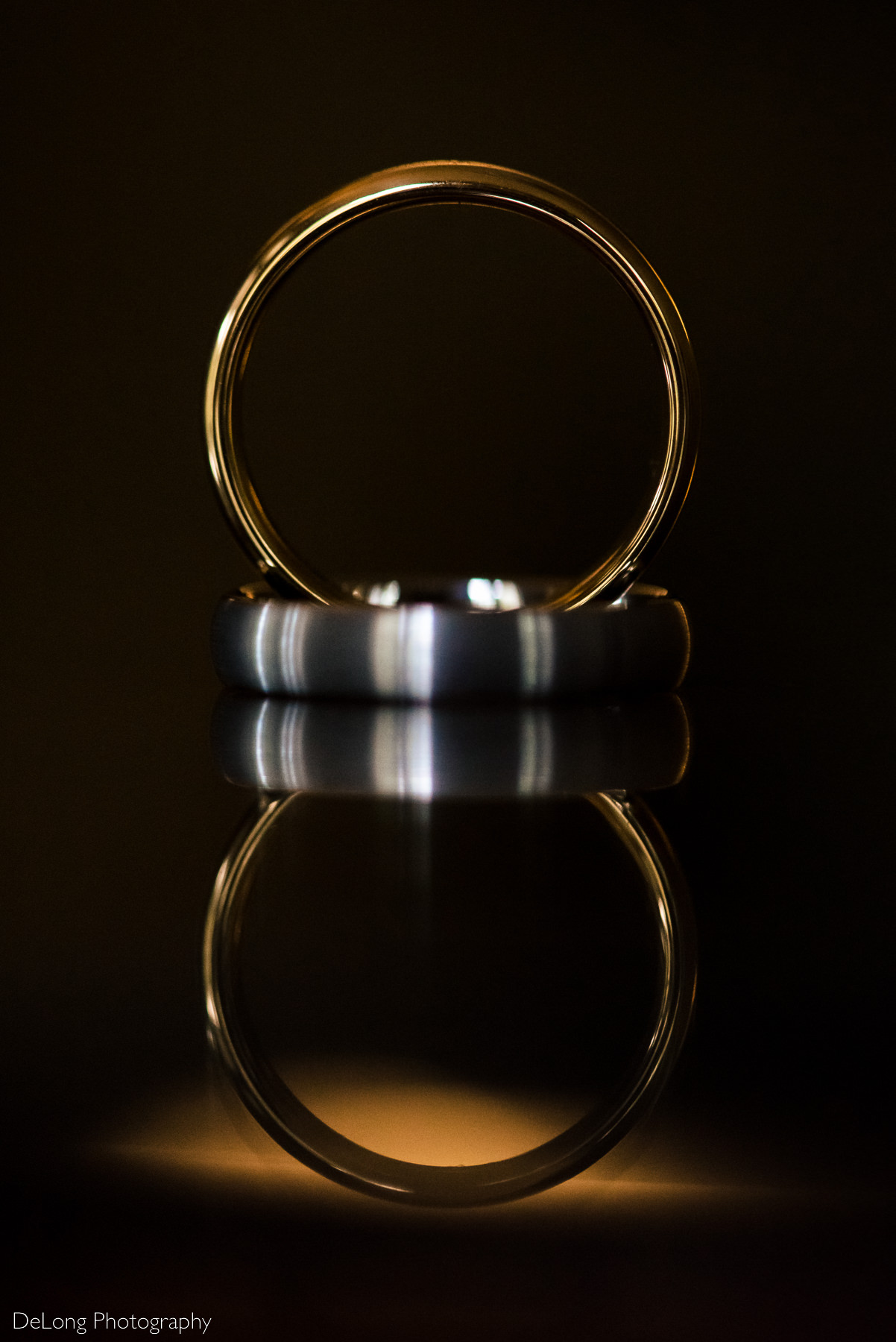 Wedding ring reflection detail photograph for same-sex wedding at the Duke Mansion by Charlotte wedding photographers DeLong Photography