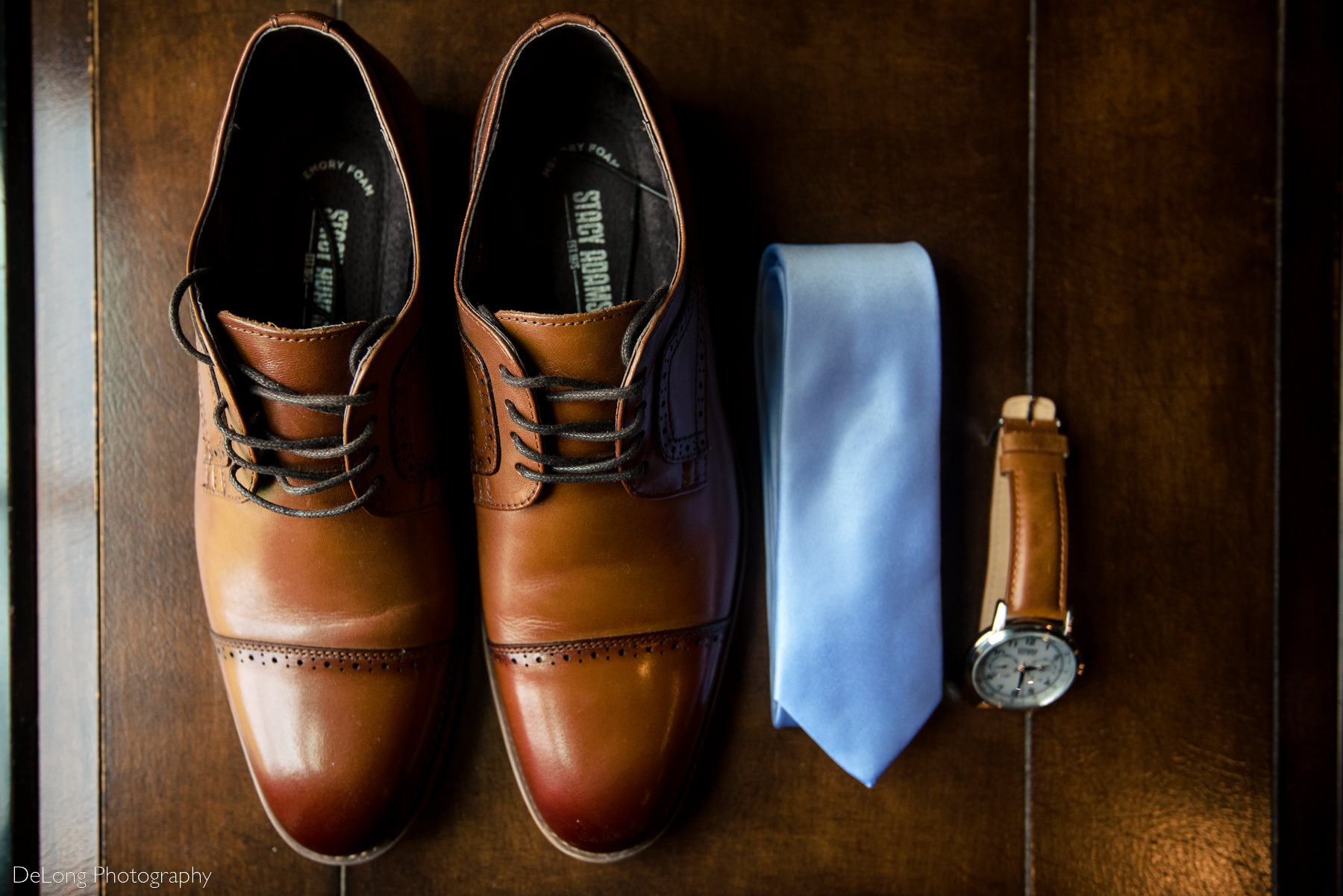 Groom's details of mens tan leather shoes, pale blue tie, and watch by Charlotte Wedding Photographers DeLong Photography