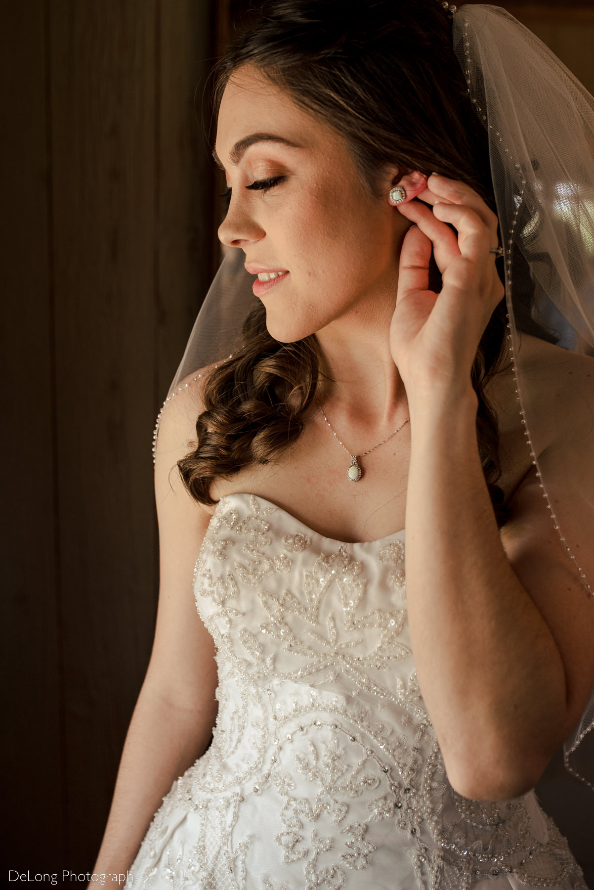 Image showcasing a bride's opal earrings and necklace