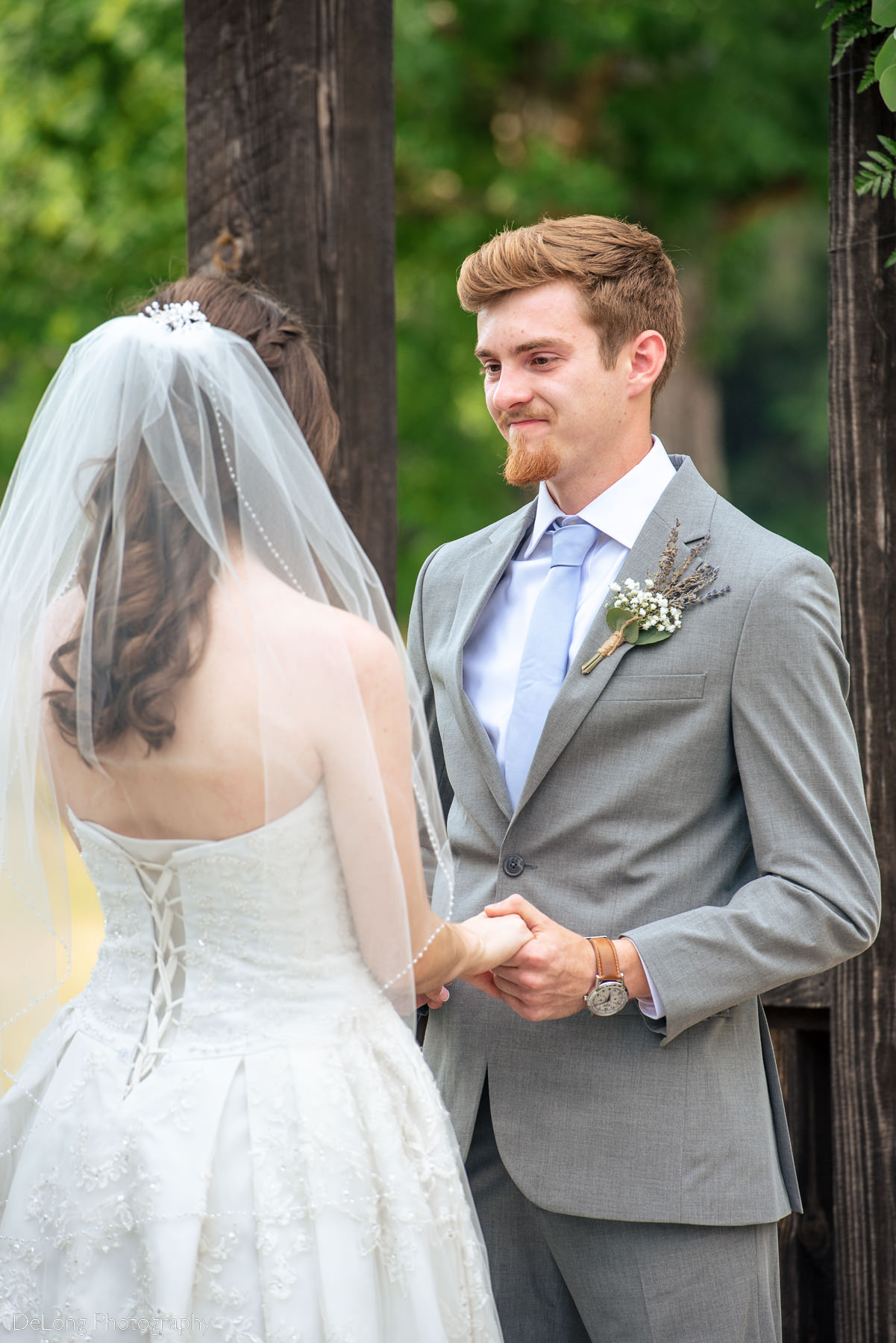 Emotional groom during wedding ceremony at Lady Bird Farms by Charlotte Wedding Photographers DeLong Photography