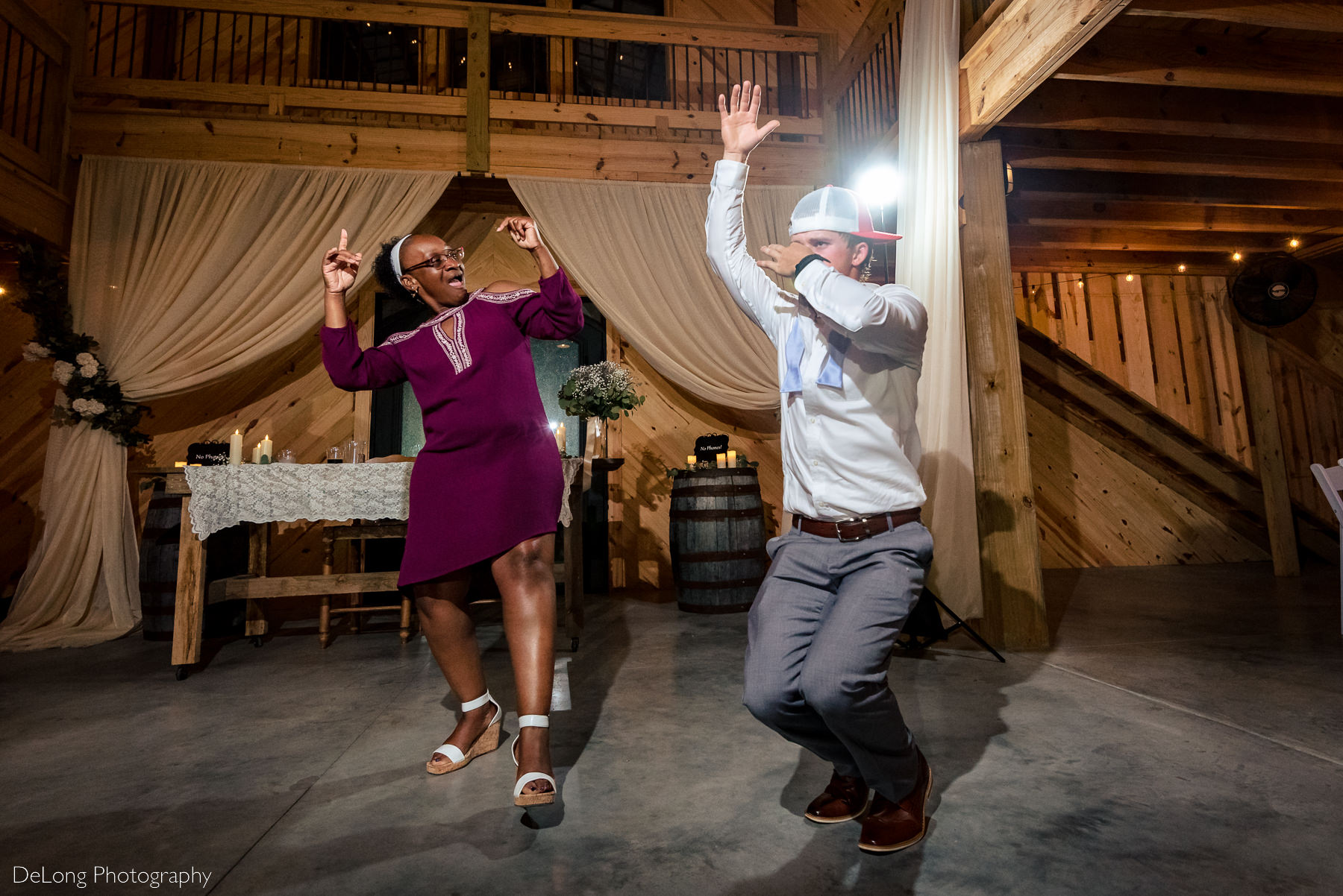 Funny dancing image during wedding reception at Lady Bird Farms by Charlotte Wedding Photographers DeLong Photography