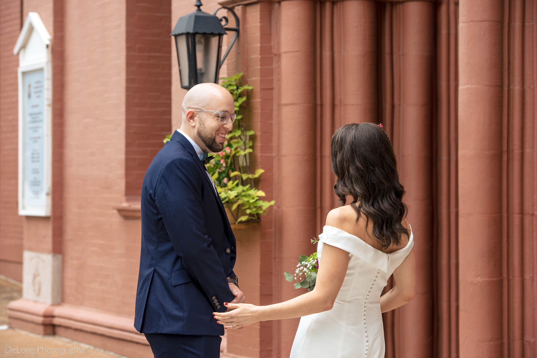 Groom's reaction during first look outside the Basilica of the Sacred Heart of Jesus in Atlanta, GA by Charlotte wedding photographers DeLong Photography