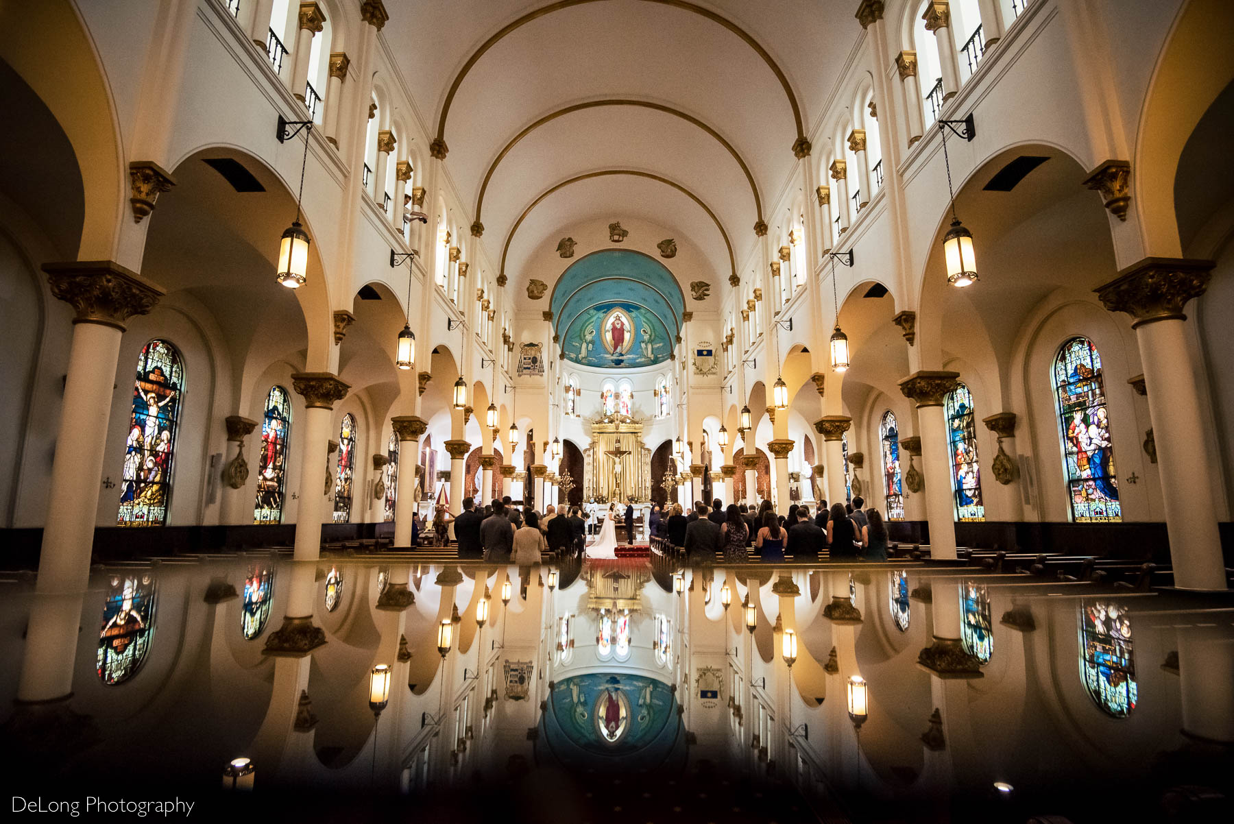 Reflection photograph during a wedding ceremony at the Basilica of the Sacred Heart of Jesus in Atlanta, GA by Charlotte wedding photographers DeLong Photography 