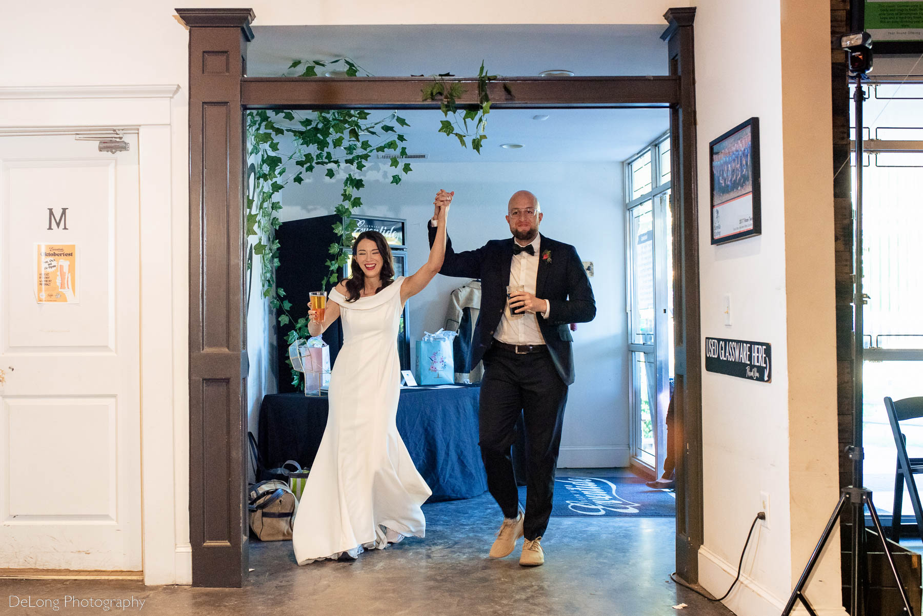Bride and groom reception entrance at Eventide Brewing in Atlanta, GA by Charlotte wedding Photographers DeLong Photography