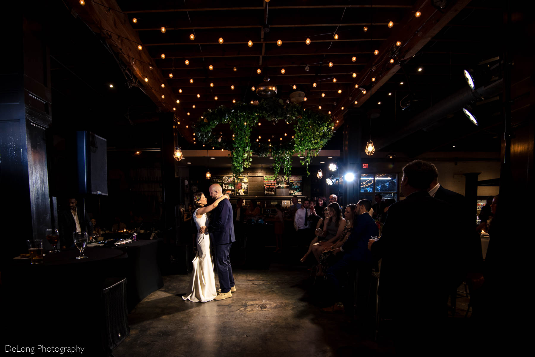 Bride and groom first dance at Eventide Brewing in Atlanta, GA by Charlotte wedding Photographers DeLong Photography