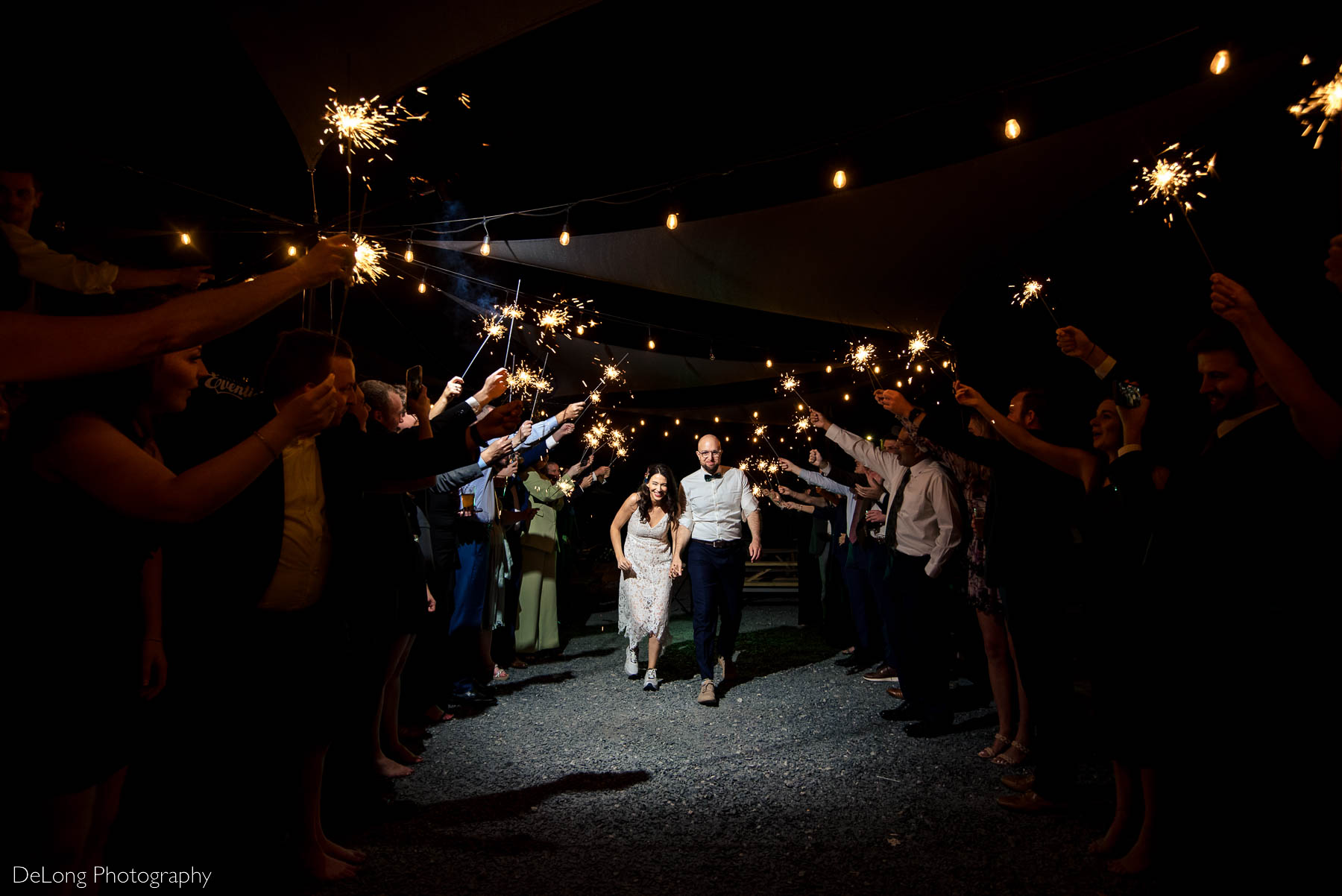 Bride and groom sparkler exit outside Eventide Brewing in Atlanta, GA by Charlotte wedding Photographers DeLong Photography