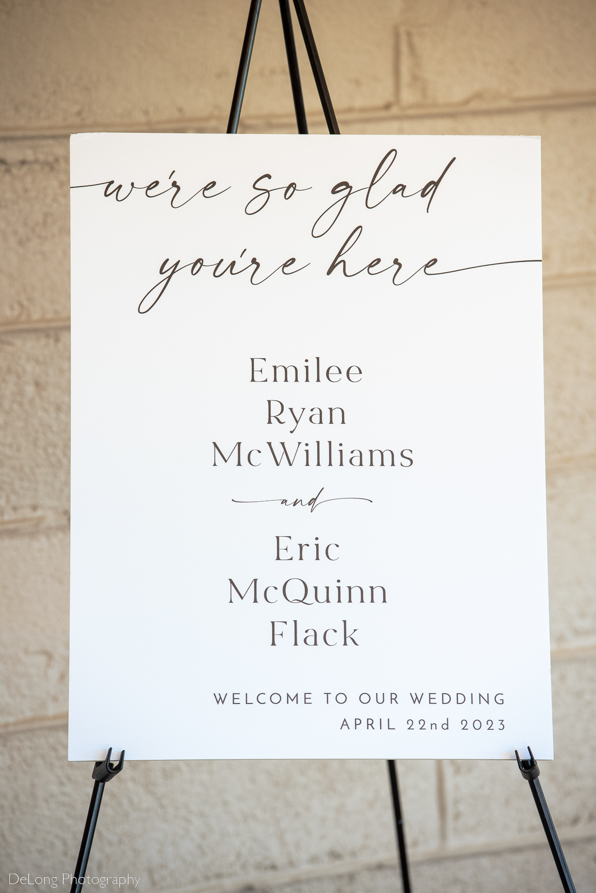 Modern and clean black and white ceremony sign at Upstairs Atlanta. Photograph by Charlotte wedding photographers DeLong Photography.