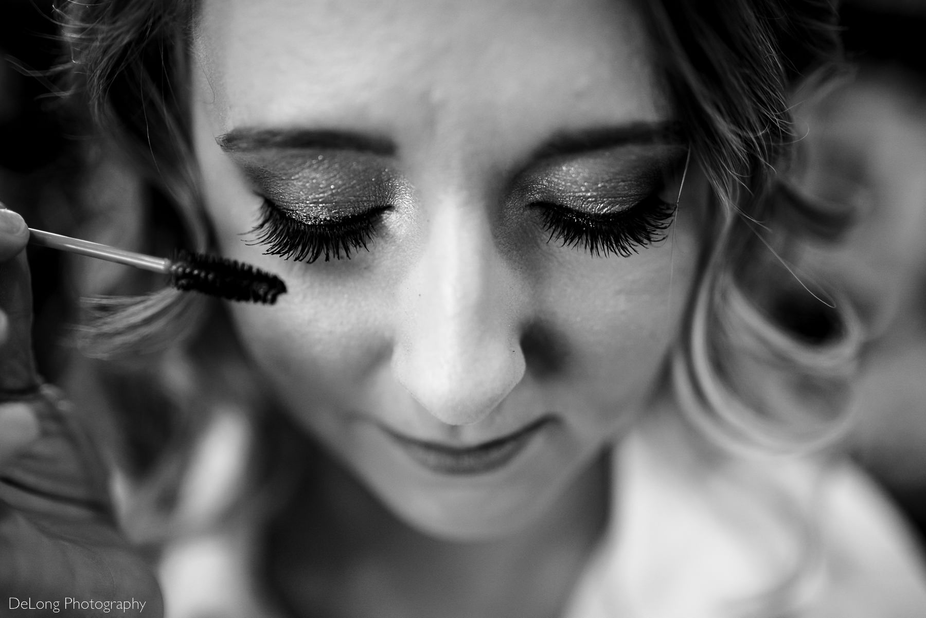 Up close macro photograph of bride's eyelashes while mascara is being applied at Pine Island Country Club in Charlotte, NC by Charlotte wedding Photographers DeLong Photography