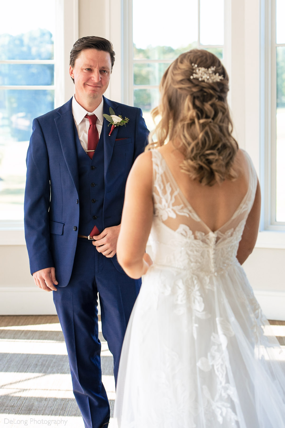 Groom overcome with emotion as he sees his bride during their private first look at Pine Island Country Club in Charlotte, NC by Charlotte wedding Photographers DeLong Photography