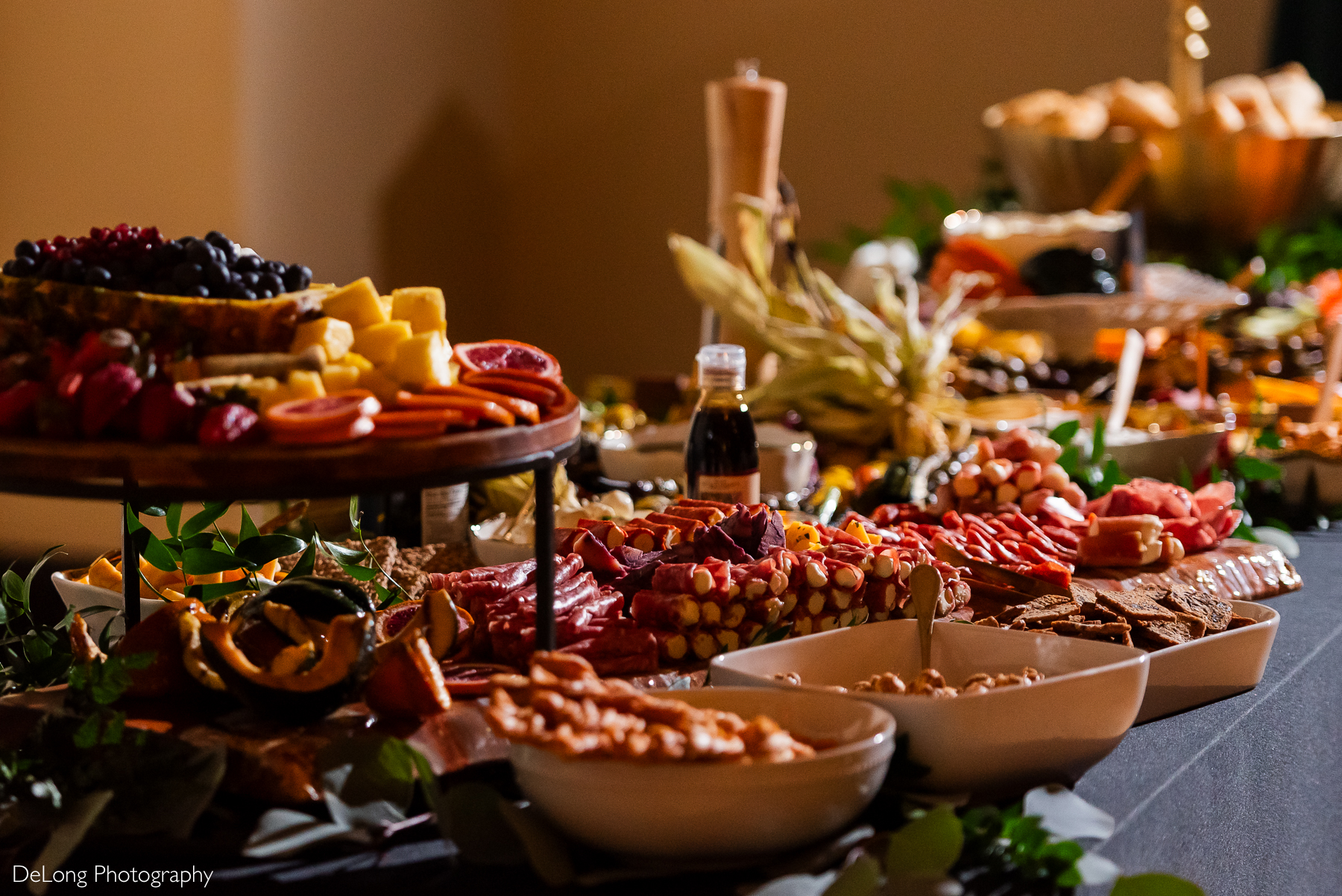 Photo of the food spread presentation created by Sage and Spice Catering. Photograph by Charlotte wedding photographers DeLong Photography taken at the Asheville Masonic Temple.