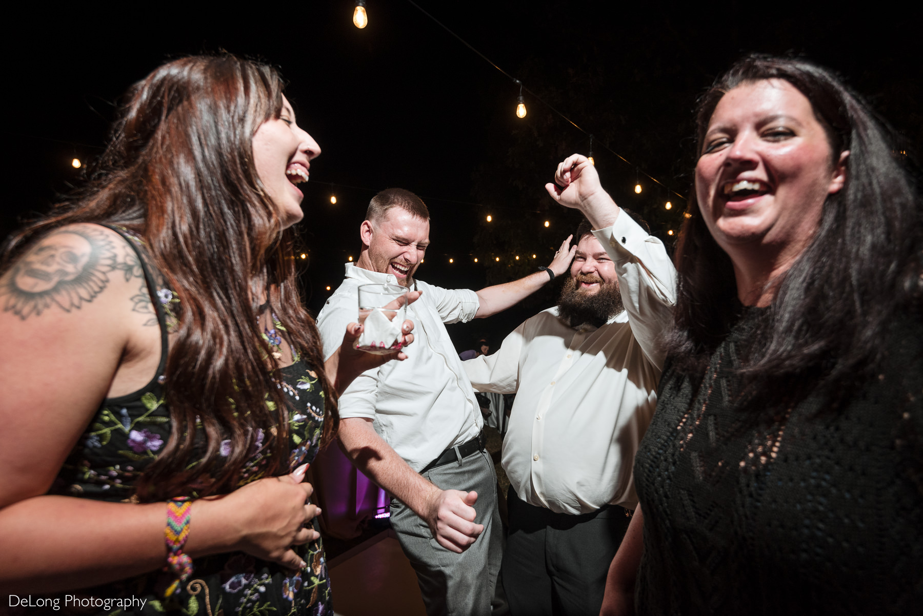 Guests enjoying a lively dance floor moment during a fall wedding reception at The White Home in Rock Hill, SC.